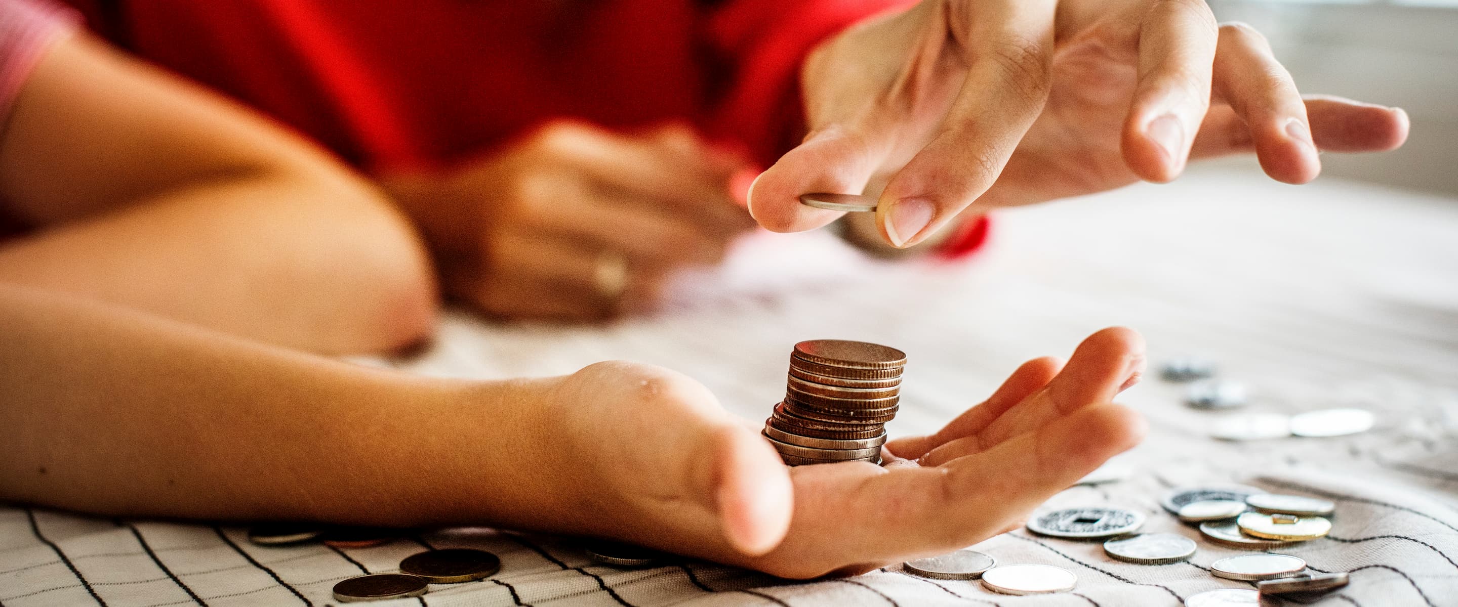 Zoomed picture of a palm with coins in it